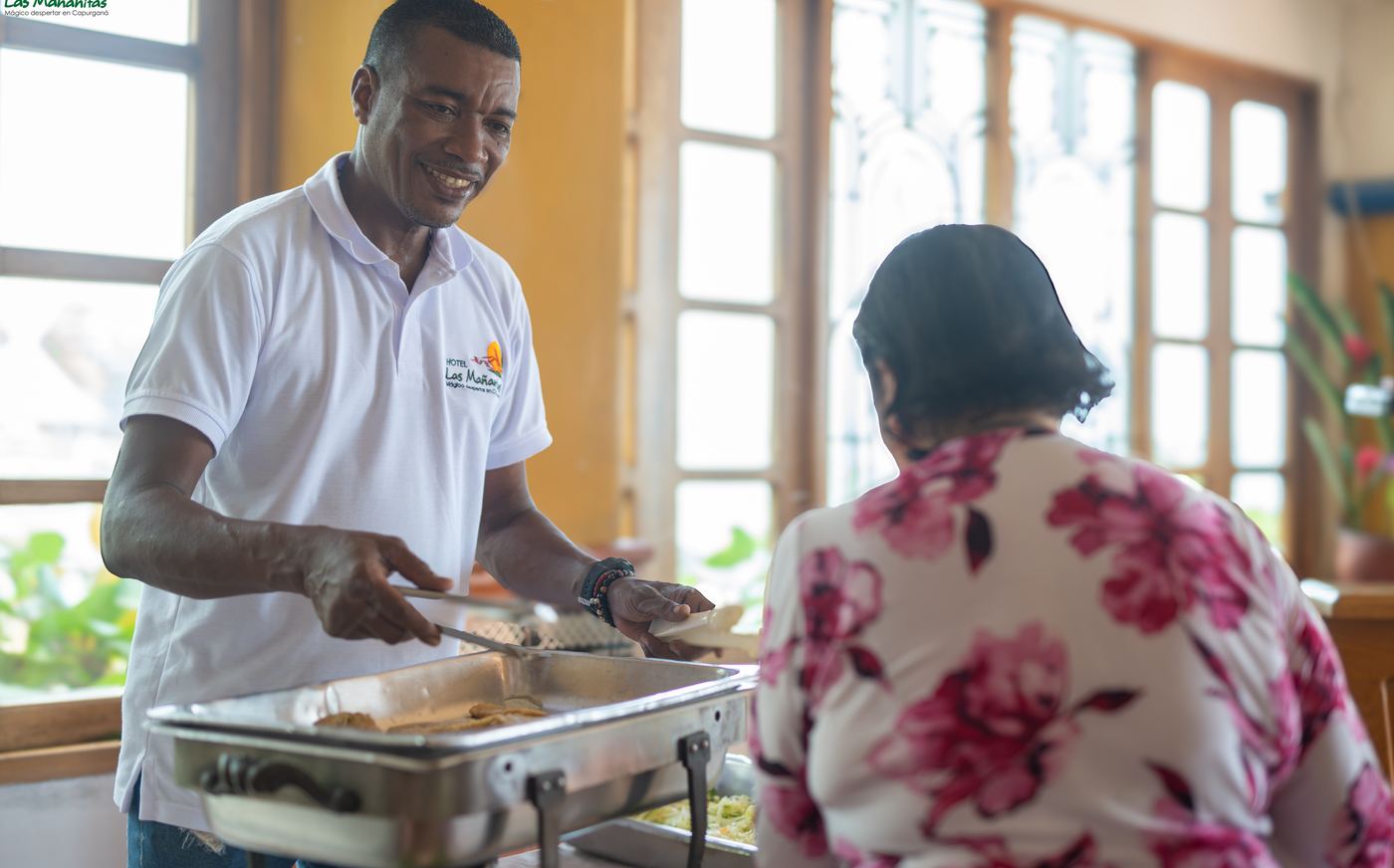 Our cook serving at the buffet