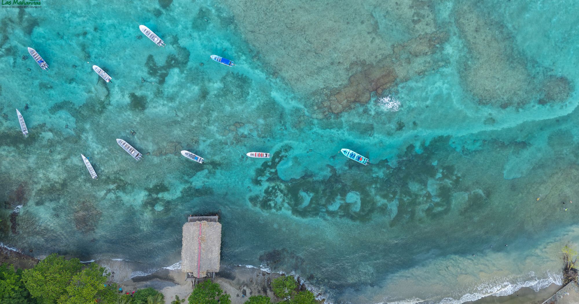 Reef and fishing boats in the bay of Capurganá