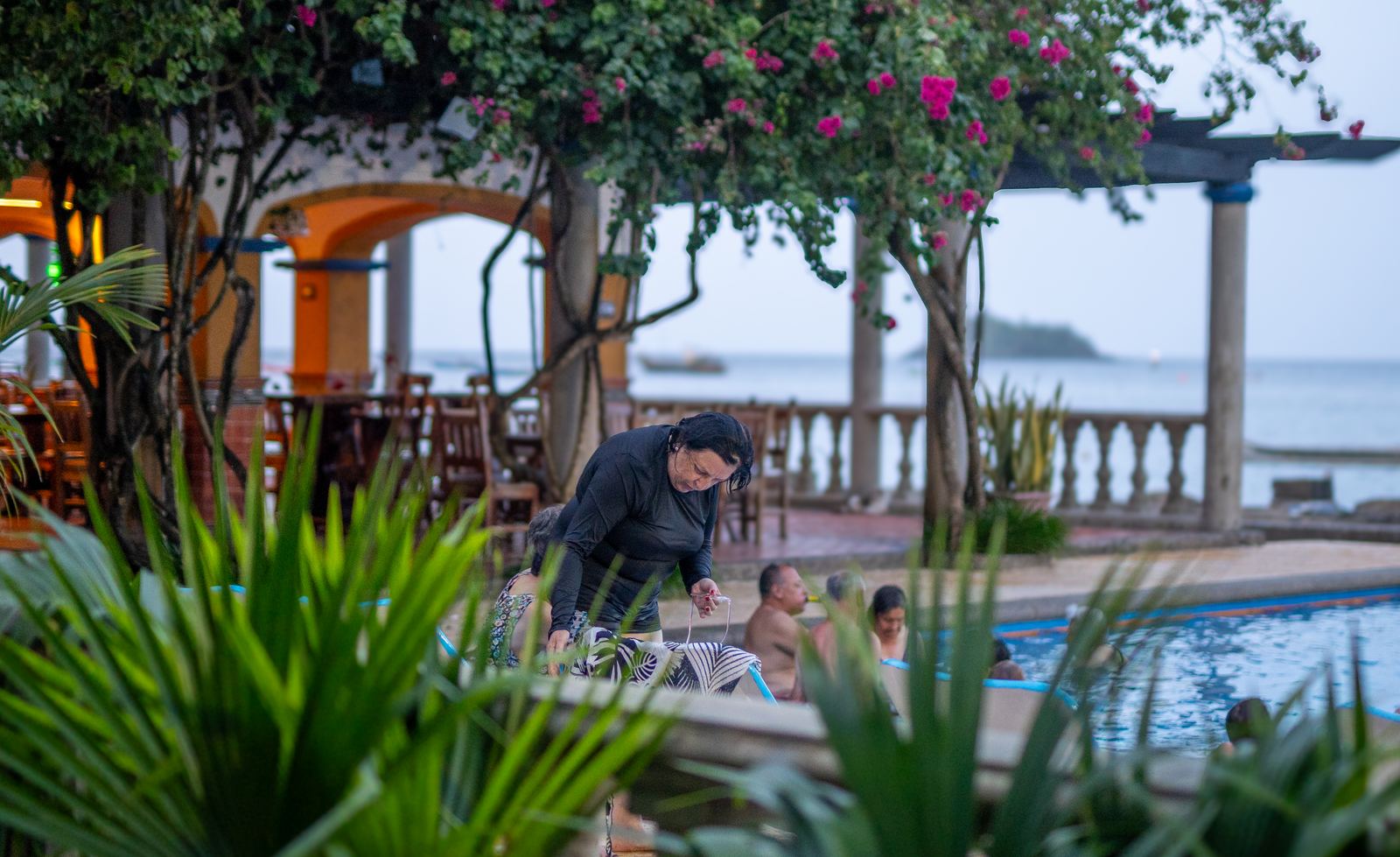 Restaurant arches under bougainvillea